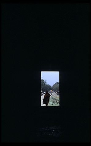 Silhouette of a monk in Angkor Wat.