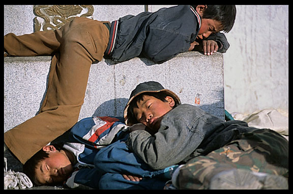 Sleeping children in front of the Jokhang.